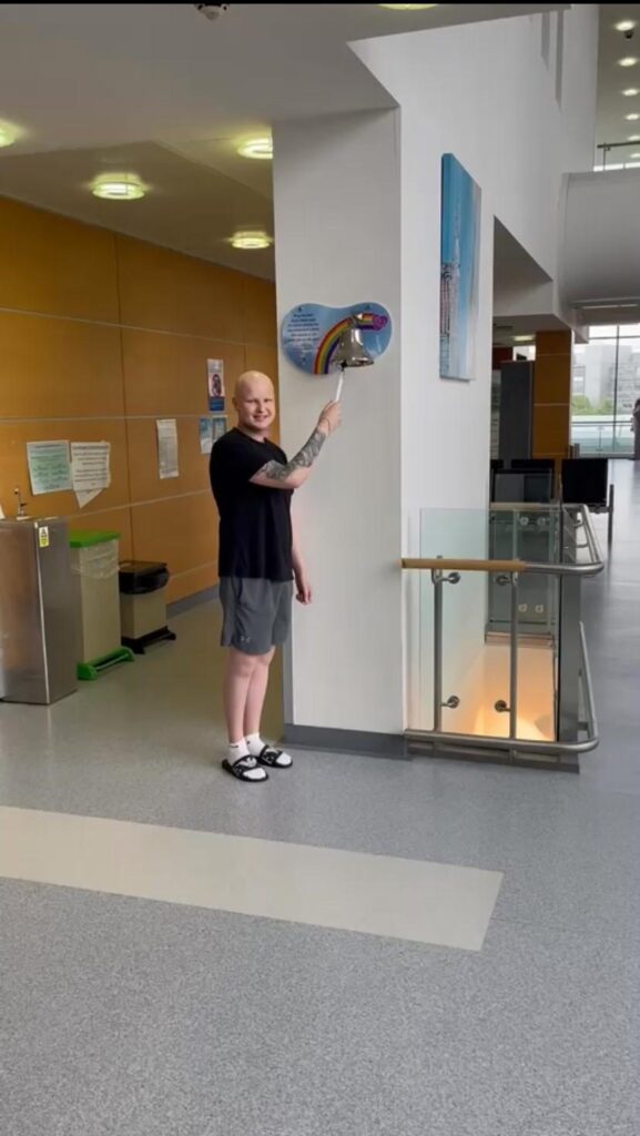 Ryan ringing the end of treatment bell at the Northern Centre for Cancer Care.