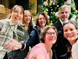 Dr Elizabeth Murphy is pictured centre after receiving a Lifetime Achievement Award from The Society of Occupational Medicine. 