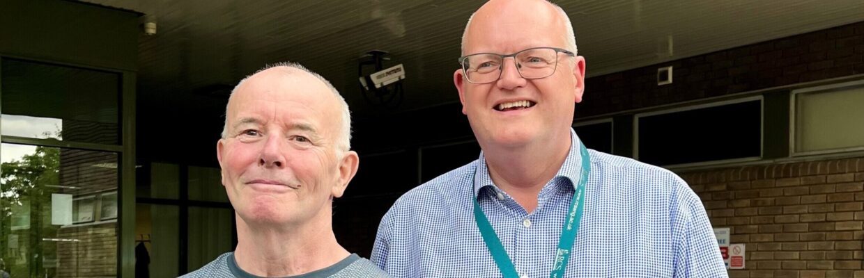 A photo of heart surgery patient and his consultant, standing outside the Freeman Hospital in Newcastle.